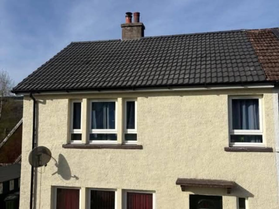 A tidy finished roof on a rendered home.