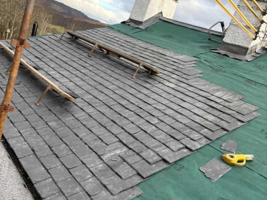 Slating work in progress around the chimney stacks.