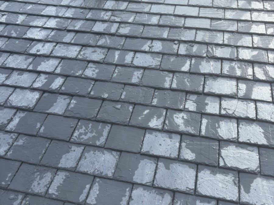 Freshly laid slate roof after the rain.