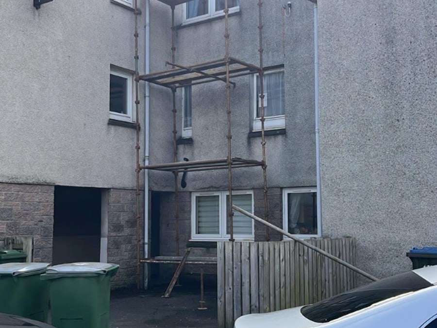 Scaffold access set up for work on a block of flats.